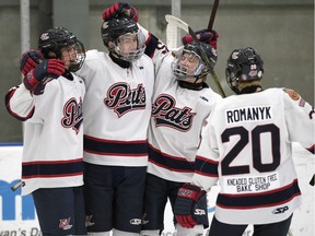 The Regina Pat Canadians' Noah Kuntz, second from left, celebrates a goal against the Saskatoon Contacts in Saskatchewan Midget AAA Hockey League playoff action Friday at the Co-operators Centre.