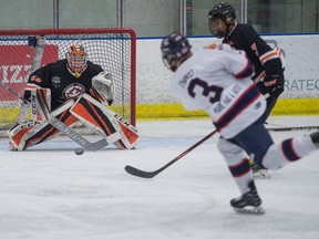 The Regina Pat Canadians' Ayden Third fires a shot toward Saskatoon Contacts goalie Cole Johnston during Saskatchewan Midget AAA Hockey League playoff action Tuesday at the Co-operators Centre.