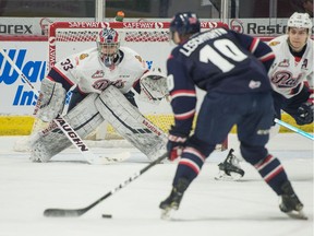 Jake Leschyshyn of the Lethbridge Hurricanes takes a shot against his former teammate, Regina Pats goaltender Max Paddock, on Saturday at the Brandt Centre.