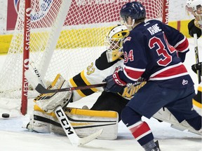 The Regina Pats' Riley Krane (#34) can't get the puck past Brandon Wheat Kings goalie Jiri Patera in WHL action at the Brandt Centre on Friday.