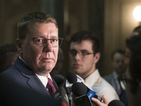 Premier Scott Moe speaks with journalists in the rotunda of the Legislative Building on March 4, 2019.