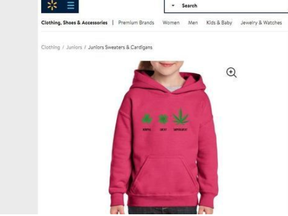 The pink, child-size hoodie features a three-leaf clover with the word “normal” underneath, followed by a four-leaf clover with the word “lucky,” and a large cannabis leaf with the word “superlucky.”