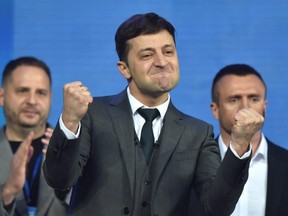 Presidential candidate Volodymyr Zelensky reacts during a presidential election debate with the Ukrainian President, at Olimpiyski stadium in Kiev on April 19, 2019.