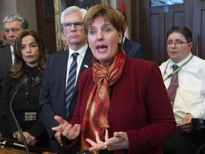 Surrounded by colleagues, International Development Minister Marie-Claude Bibeau and International Trade Diversification Minister James Carr respond to questions from the media about canola during a news conference in the Foyer of the House of Commons Monday April 1, 2019 in Ottawa.