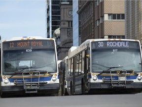 City of Regina buses travelling through the downtown.