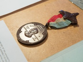 A royal medal, which comes from a group originally presented to First Nations chiefs, lays on the coin display table of George Manz, who was exhibiting his collection at the Regina Coin Club show held at the Turvey Centre.