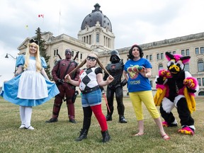 From left, Queen City Cosplay members Heather Hinks (as Disney's Alice), Ken Sibbald (as Marvel character Deadpool), Ella Sibbald (as DC Comics character Harley Quinn), Andrew Patrick (as Iron Vader, a mashup between Marvel's Iron Man and Darth Vader of the Star Wars series), Courtney Foster (as Snow White) and Michael Schmidt (as Qwibex, an original creation) stand in front of the Saskatchewan Legislative building.