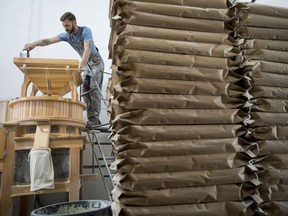 Christian Bendsen, production manager and head miller of Flourist works the stone mill at their production facility in Vancouver, Friday, April, 5, 2019. Flourist and other fresh flour producers have seized on rising demand for whole, traceable baking ingredients, as well as a stronger connection between consumers and farmers.