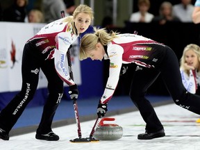 Second Jocelyn Peterman, left, and lead Dawn McEwen sweep as skip Jennifer Jones of Winnipeg watches during the first draw at the Princess Auto Elite 10 at Thames Campus Arena in Chatham, Ont., on Wednesday, Sept. 26, 2018. Jones and her teammates are the reigning women's world champions. Ten women's teams and 10 men's teams are playing in the $200,000 Grand Slam of Curling tournament that ends Sunday, Sept. 30, 2018.