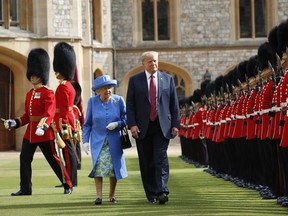 U.S. President Donald Trump and Britain's Queen Elizabeth inspects the Guard of Honour at Windsor Castle during the president's last visit to the U.K. Trump will pay a state visit to Britain in June as a guest of Queen Elizabeth II.