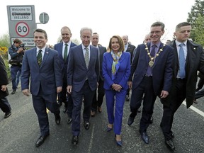 Delegates, from left, U.S. Congressman Brendan Boyle, Irish Education Minister Joe McHugh, U.S. Congressman Richard Neal and US House of Representatives speaker Nancy Pelosi, cross the Irish border from Northern Ireland into the Republic of Ireland, at Bridgened in Co Donegal, Thursday April 18, 2019. Pelosi and other members of the U.S. delegation made the symbolic border crossing, that is the contentious Brexit border, between North and southern Ireland Thursday, as part of her four-day visit to Ireland and Northern Ireland.