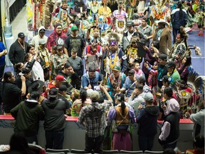 A competitive drum and song group performs during the First Nations University Powwow held at the Brandt Centre.