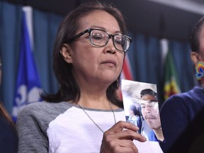 Debbie Baptiste, mother of Colten Boushie, holds a photo of her son during a press conference on Parliament Hill in Ottawa on February 14, 2018. Debbie Baptiste says she went into the trial of the man accused of killing her son with hope. Hope that she would find justice for Colten Boushie, a 22-year-old Cree man who was shot and killed on a farm near Biggar, Sask., in August 2016. But after two weeks of court proceedings and 13 hours of jury deliberation, she left angry. A jury found the farmer who fired the gun that day, Gerald Stanley, not guilty of second-degree. The man who admitted killing her son walked from the courthouse a free man.