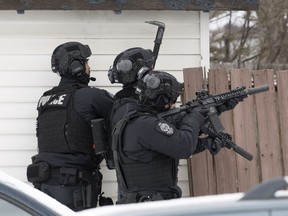 Members of the Regina Police Service, along with members of their SWAT (Special Weapons and Tactics) team, surrounded a house on the 2000 block of Ottawa Street in Regina.