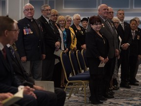 Recipients of the Saskatchewan Volunteer Medal stand during a ceremony held at the Hotel Saskatchewan on Victoria Avenue.