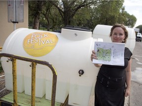 Amanda Minion, sponsorship and communications manager for the Regina Folk Festival, is with some of the portable water that will be available during the show for fans to help deal with the heat  in Regina on Aug. 7, 2018.