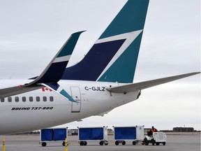 REGINA SK: MARCH 30, 2016 – WestJet planes on the tarmac at Regina International Airport.