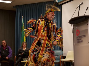 Cal Arcand dances onstage at the Francis Morrison Library Theatre in Saskatoon during a rally in favour of Bill C-262 on March 2. Bill C-262 supports a United Nations declaration of Indigenous rights adopted in 2007.