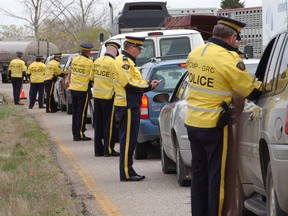 Drivers faced a line-up of RCMP and other law enforcement officers at a check-stop on the Trans-Canada Highway west of Regina.
