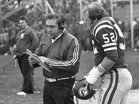 Saskatchewan Roughriders head coach John Payne, left, with offensive lineman Jim Hopson during a 1975 home game against the Edmonton Eskimos.