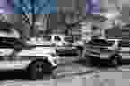 Police vehicles sit in front of an apartment building on the 1900 block of Halifax Street on May 4, 2019.