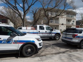 Police vehicles sit in front of an apartment building on the 1900 block of Halifax Street on May 4, 2019.