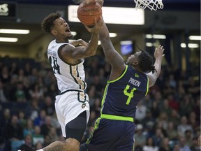 Saskatchewan Rattlers guard Negus Webster Chan takes a shot against Niagara Lions guard Dorian Pinson during the Canadian Elite Basketball League season-opener at SaskTel Centre in Saskatoon on Thursday, May 9, 2019.