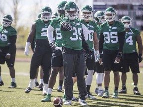 Defensive end Charleston Hughes (39) worked on drills during the Saskatchewan Roughriders' training camp after dealing with questions regarding the new collective bargaining agreement.