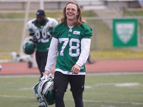 Colton Holmes (number 78), a Saskatoon Hilltops and Aden Bowman Collegiate alum, practiced at Saskatchewan Roughrider training camp at Griffiths Stadium on May 23, 2019.