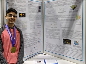 Campbell Collegiate Grade 10 student Ali Rizvi stands in front of his project display at the Canada-Wide Science Fair in Fredericton, NB. Rizvi won a gold medal at the science fair for his project Detecting Exoplanets Using Supervised Machine Learning.