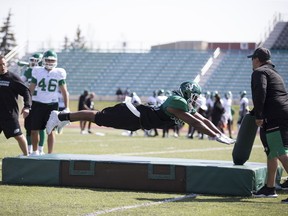 Roughrider LB Deon King dives onto the mat during practice at the Riders training camp at Griffiths Stadium in Saskatoon, Sk on Monday, May 27, 2019.