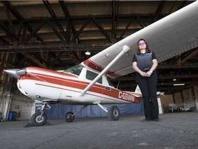 Audrey Kahovec, general manager of the Regina Flying Club, stands by a Cessna 150 inside the hanger at the Regina International Airport in Regina.