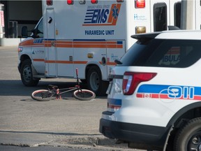 A bicycle lays on the parking lot at the Co-op service station on the corner of Park Street and Dewdney Avenue where emergency responders attended to the scene of an incident.