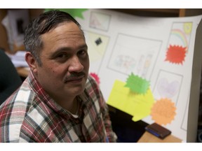 Robert McGavin, executive director for Restorative Circles Initiative, the organization that oversees the New Horizons Program, sits inside of his busy office on May 2, 2019. Located in Saskatoon's downtown, he sits in front of a poster assembled by one of the youth who worked with a New Horizons mentor to help them through the court process.