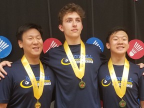 O'Neill athletes Nathanyal Eng, left, Colin Tetreault, centre, and Nyklaas Eng are shown with their gold medals Saturday at the Saskatchewan High Schools Athletic Association badminton championships in Swift Current.
