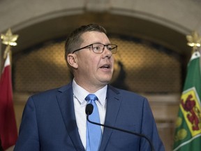 Premier Scott Moe  responds to reporters after losing a Saskatchewan Court of Appeal's decision on the carbon tax in the Legislative Building in Regina.