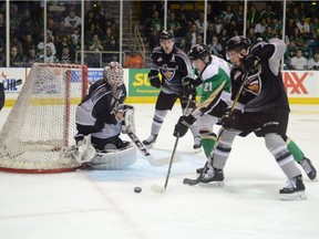 Vancouver Giants goalie David Tendeck keeps an eye on the puck as Raider Aliaksei Protas is flanked by three Giants during Game 7 WHL championship final action in Prince Albert. Uploaded May 13, 2019. Photo by Peter Lozinski, Prince Albert Daily Herald.