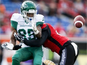 Saskatchewan Roughriders receiver Kyran Moore, 85, couldn't hold on to this pass from Cody Fajardo during Friday's 37-1 pre-season loss to the host Calgary Stampeders.