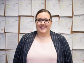 Ashley Boha, executive director of the Regina Work Preparation Centre,  in front of the centre's job posting board at the Halifax Street office.