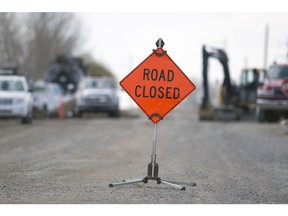 A road closed sign sits on 13th Avenue west of Sandra Schmirler Way as crews perform water and sewer work in Regina.