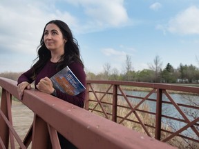 Jenn Smith Nelson stands on a bridge on Boreal Island, one of her favourite nature spots in Regina.