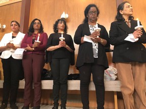 Women hold candles at a solidarity vigil held to honour victims of the Sri Lanka Easter bombings. The vigil was organized by Regina's Sri Lankan community and held at Jean Paul's Chapel on Sunday, May 5, 2019.