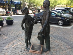 The statue at First Avenue and 21st Street showing a meeting between a young John Diefenbaker and Prime Minister Wilfrid Laurier.