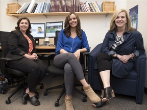 Heather Hadjistavropoulos, executive director of the Online Therapy Unit and psychology professor, right, along with Cynthia Beck, a clinical psychology master's student, left and Victoria Suchan, a clinical psychology PhD student, middle pose together for a photo at the University of Regina.