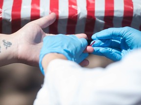 An HIV test is administered by a public health nurse with the Saskatchewan Health Authority in June 2018.