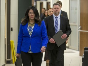 Saskatoon board of police commissioners chair Darlene Brander, left, walks down a hallway with new chief of police for the Saskatoon Police Service Troy Cooper prior to a media event at city hall in Saskatoon, SK on Wednesday, January 17, 2018.