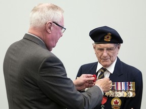 Harold Hague, receiving one of the Legion campaign's first poppies in 2018, says the first thing for those starting off in work to know is "Save!"