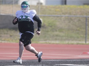 Riders centre Dan Clark kept in shape while jogging in the end zone at Griffiths Stadium while recovering injuries sustained in a single-vehicle accident on May 7.