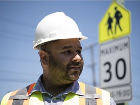 Faisal Kalim, manager of traffic engineering at the City of Regina, speaks about the new 30/km hour speed sign at Glen Elm Community School in Regina. The bylaw for the new speed comes into effect September 1, 2019.