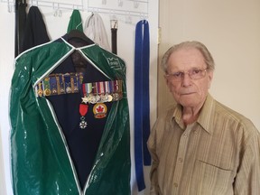 Harold Hague stands with his Second World War uniform and medals. Hague is a veteran of D-Day; the 75th anniversary of which is Thursday. Photo by Ethan Williams